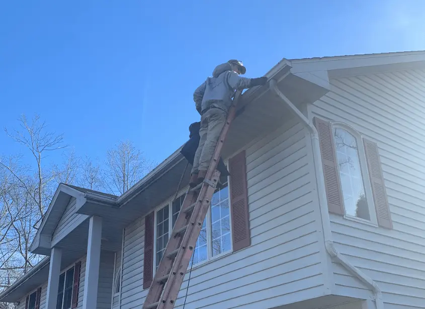 Gutter cleaning and maintenance being performed by Lyndhurst Power Washing in Lyndhurst